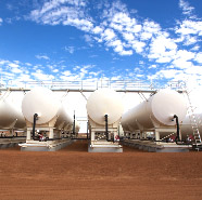 Four white gas storage cylinders siting on the red earth of the Cooper Basin