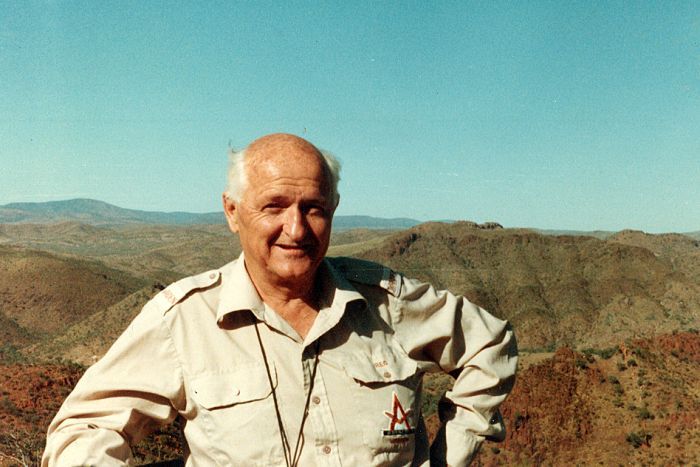 Historic photo of Reg Sprigg standing in the Flinders Rangers